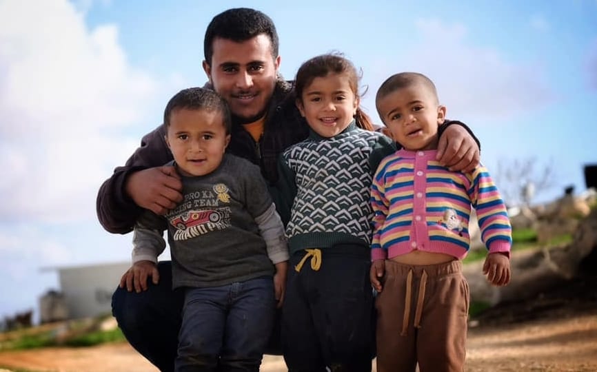 Tariq Hathaleen and the children of Um al-Khair. Photo by Steve Pavey